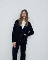 Giacca in maglia nera con bottoni