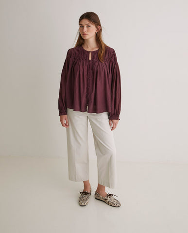 Blusa plissettata in cotone color melanzana