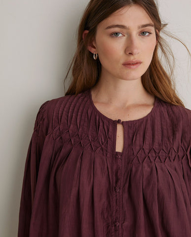 Blusa plissettata in cotone color melanzana